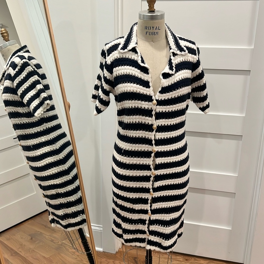 Vestique knit white and blue dress with gold button detailing.
